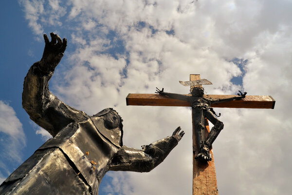 Christ staue with Virgin Mary wailing at his feet
