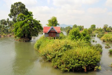House on one of 4000 islands in the Mekong clipart
