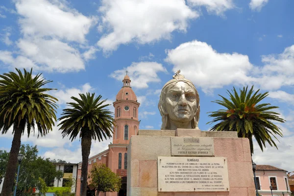 Incan chieftain and Spanish church in market town — Stock Photo, Image