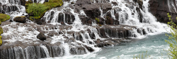 Panorama of Hraunfossar waterfall cascade in Iceland. Europe