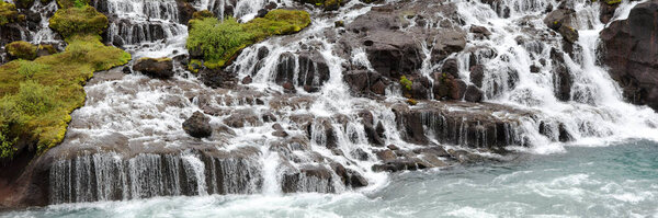 Panorama of Hraunfossar waterfall cascade in Iceland. Europe