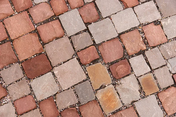 Kaldırımda kırmızı kaldırım taşları. Taş arkaplan