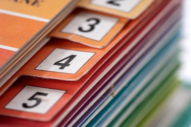 Closeup of the colorful number register of a folder. Shallow depth of field