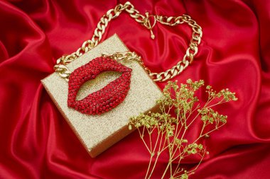 red sexy background with  gift box and necklace