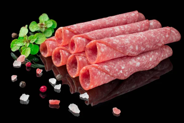 Salami Slices Herbs Black Background — Stock Photo, Image