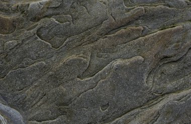 Taşın soyut doğal arka planı ve tuhaf bir dokusu var. 