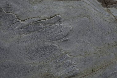 Taşın soyut doğal arka planı ve tuhaf bir dokusu var. 