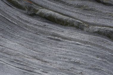 Taşın soyut doğal arka planı ve tuhaf bir dokusu var. 