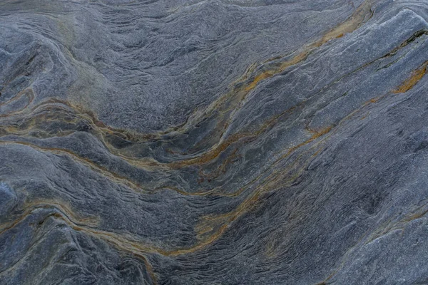 Taşın soyut doğal arka planı ve tuhaf bir dokusu var. 