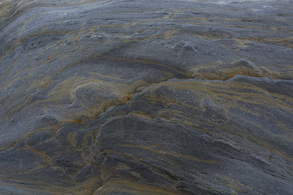 Taşın soyut doğal arka planı ve tuhaf bir dokusu var. 