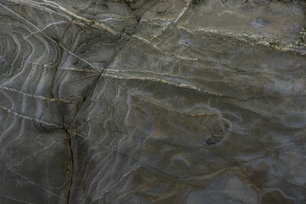 Taşın soyut doğal arka planı ve tuhaf bir dokusu var. 