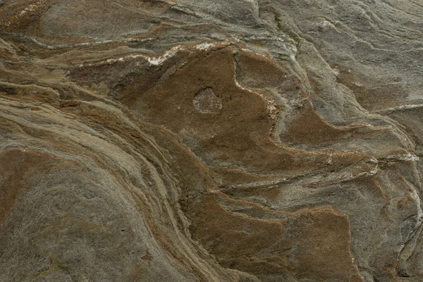 Taşın soyut doğal arka planı ve tuhaf bir dokusu var. 