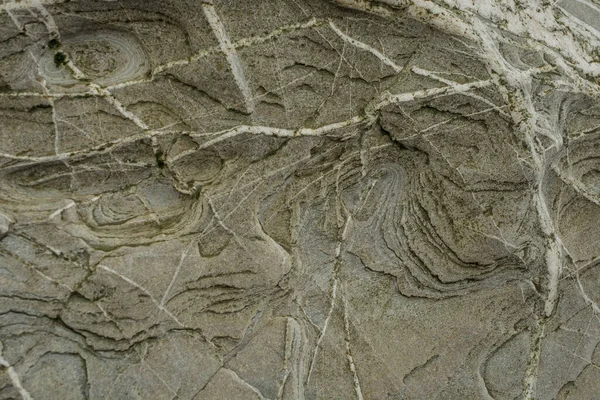 Taşın soyut doğal arka planı ve tuhaf bir dokusu var. 