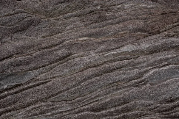 Taşın soyut doğal arka planı ve tuhaf bir dokusu var. 