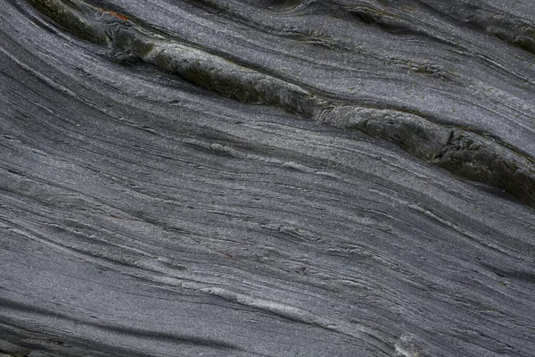 Taşın soyut doğal arka planı ve tuhaf bir dokusu var. 