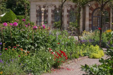 Landscaped traditional English garden with summer flowers 