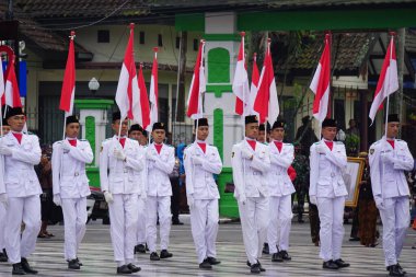 Paskibraka (Indonesian flag raiser) with national flag during grebeg pancasila
