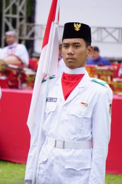 Paskibraka (Indonesian flag raiser) with national flag during grebeg pancasila