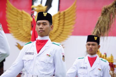 Paskibraka (Indonesian flag raiser) with national flag during grebeg pancasila
