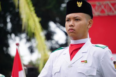 Paskibraka (Indonesian flag raiser) with national flag during grebeg pancasila