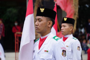 Paskibraka (Indonesian flag raiser) with national flag during grebeg pancasila