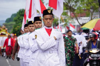 Paskibraka (Indonesian flag raiser) with national flag during grebeg pancasila