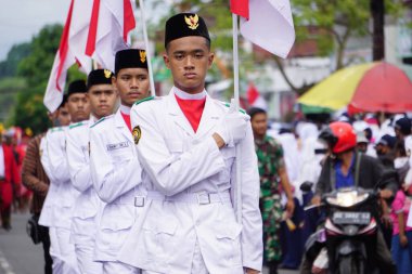Paskibraka (Indonesian flag raiser) with national flag during grebeg pancasila