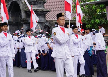 Paskibraka (Indonesian flag raiser) with national flag during grebeg pancasila