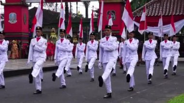 Paskibraka (Indonesian flag raiser) with national flag during grebeg pancasila