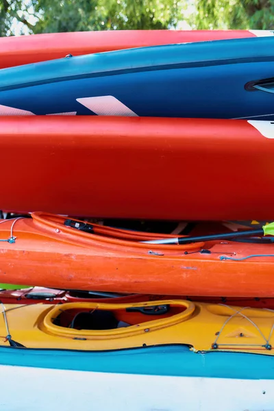 Set of colorful kayaks outdoors on beach coast — Stock Photo, Image