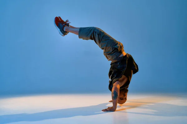 Cool european male dancer dancing breakdance