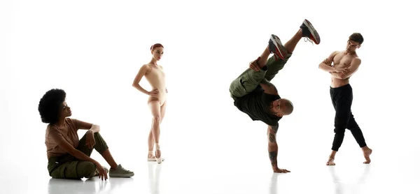 Trois danseurs qui regardent danser un danseur de break masculin — Photo