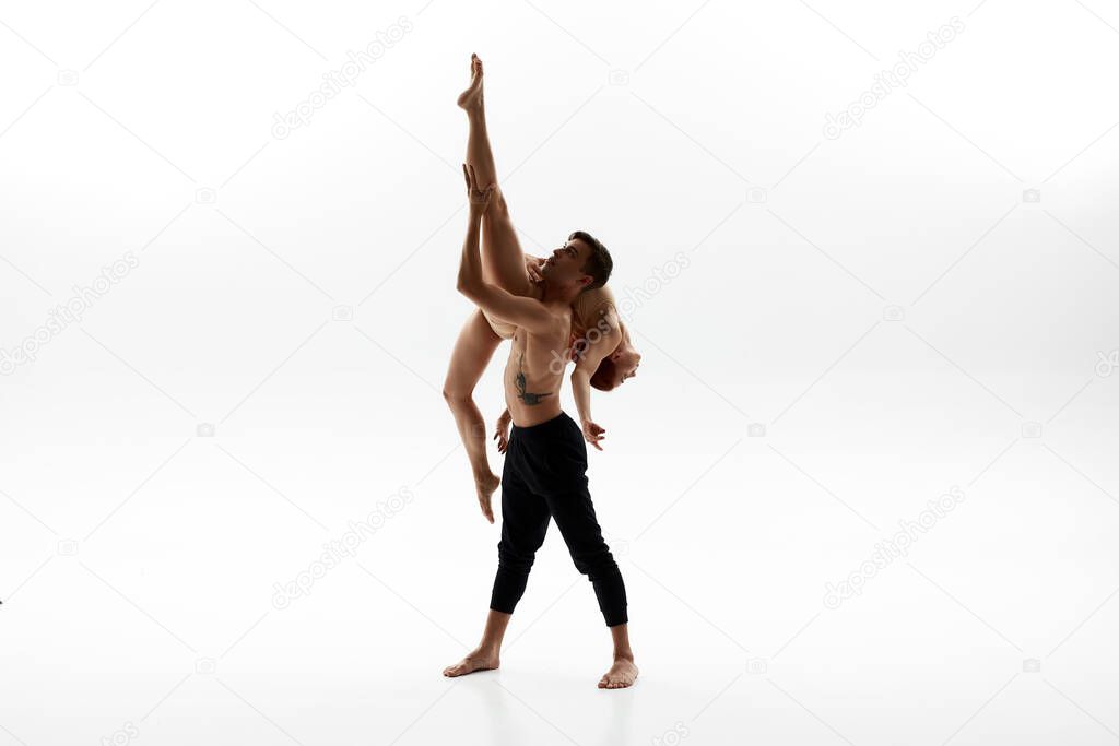 Man holding female partner during ballet dance