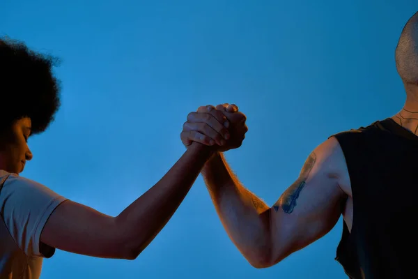 Mixed-race friends holding hands of each other — Stock Photo, Image