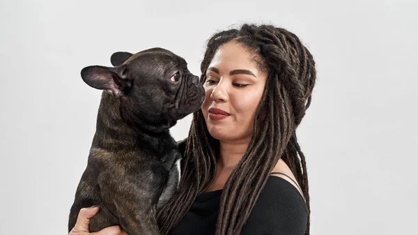 Smiling woman hold and look on French Bulldog dog — Stock Photo, Image
