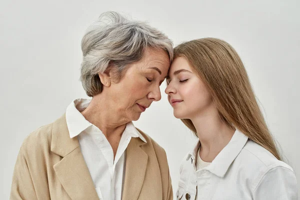 Happy girl and senior woman with closed eyes — Stock Photo, Image