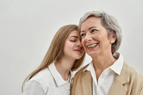 Pleased caucasian girl and her senior grandmother — Stock Photo, Image