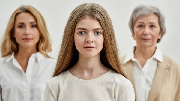 Selective focus of girl before mother and grandma — Stock Photo, Image