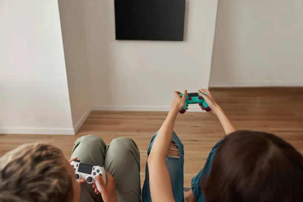 Cropped image of lesbian girls playing video game — Stock Photo, Image