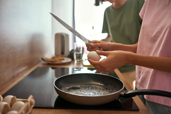 Partial of girls cooking breakfast at home kitchen — Stock Fotó