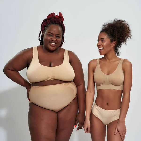 Love your body. Three attractive caucasian mature women in underwear  looking at camera Stock Photo by ©LanaStock 449061760