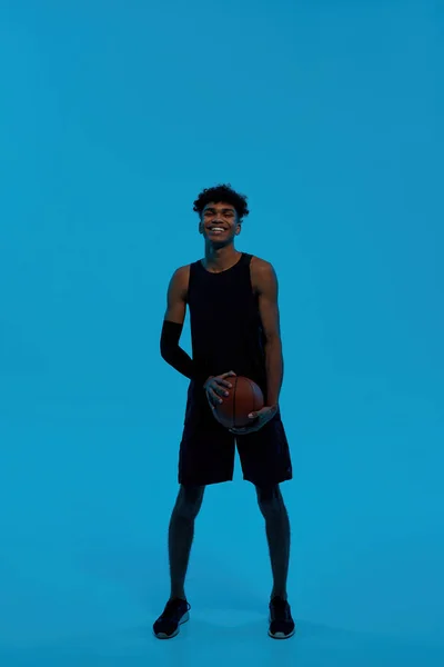 Front view of black basketball player with ball — Stock Fotó