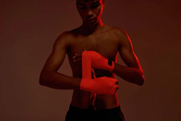 Partial image of boxer wrapping bandage on hand — Stock Photo, Image