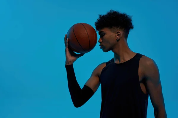Black thoughtful sports man hold basketball ball — Stock Fotó