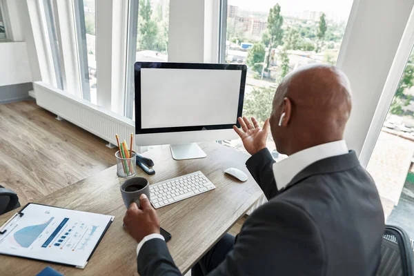 Back view of black businessman watch on computer — Foto de Stock