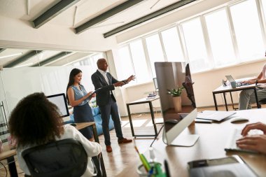 Boss tell company strategy during business meeting