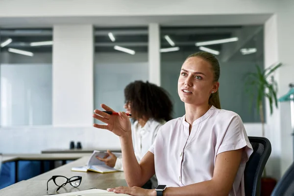 Female employee telling to boss or colleague — Stock Photo, Image