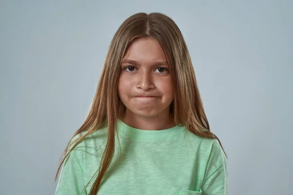 Portrait of girl with skeptical face pout lips — Stock Photo, Image