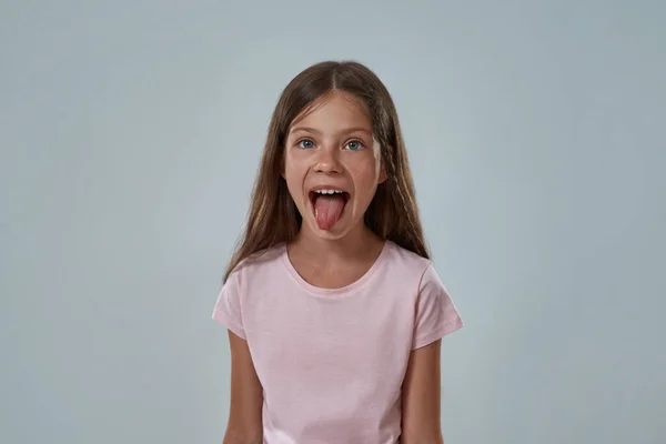 tween tongue out Alamy