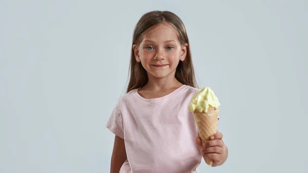 Little girl holding sweet delicious ice cream cone — Stock Photo, Image